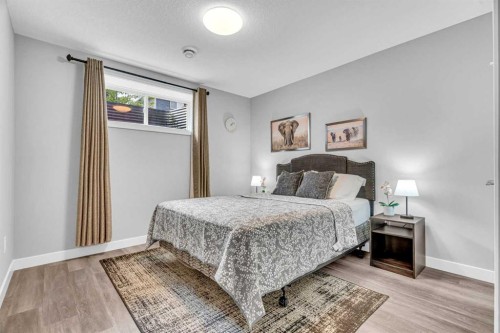 49 Creekside Avenue Sw, Calgary, AB - Indoor Photo Showing Bedroom