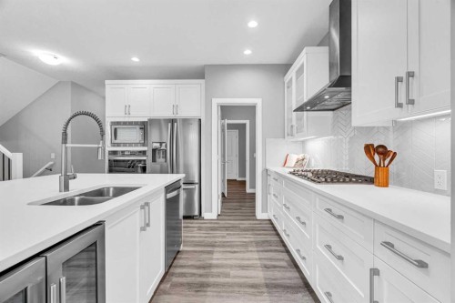 49 Creekside Avenue Sw, Calgary, AB - Indoor Photo Showing Kitchen With Double Sink With Upgraded Kitchen