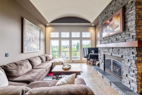 22 Tuscany Estates Crescent Nw, Calgary, AB - Indoor Photo Showing Living Room With Fireplace