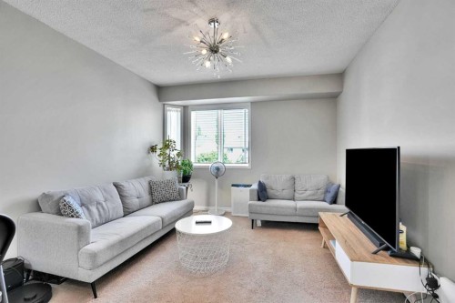 7237 Laguna Way Ne, Calgary, AB - Indoor Photo Showing Living Room