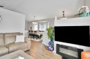 7237 Laguna Way Ne, Calgary, AB  - Indoor Photo Showing Living Room With Fireplace 