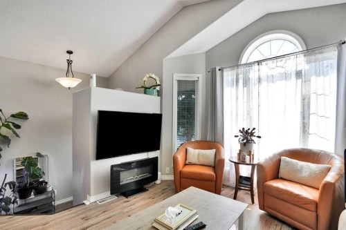 7237 Laguna Way Ne, Calgary, AB - Indoor Photo Showing Living Room With Fireplace