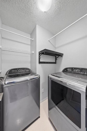 501 Patterson View Sw, Calgary, AB - Indoor Photo Showing Laundry Room