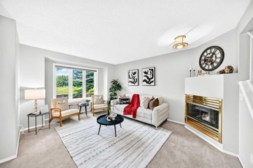 76-388 Sandarac Drive Nw, Calgary, AB - Indoor Photo Showing Living Room With Fireplace