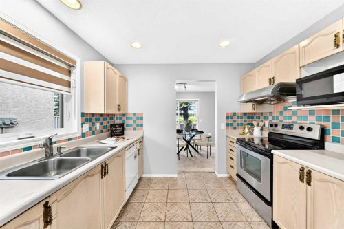 76-388 Sandarac Drive Nw, Calgary, AB - Indoor Photo Showing Kitchen With Double Sink