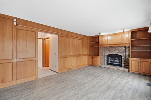 61 Shannon Crescent Sw, Calgary, AB - Indoor With Fireplace