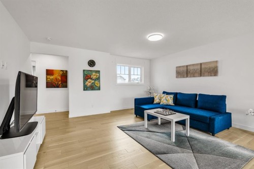 406 Rowley Way Nw, Calgary, AB - Indoor Photo Showing Living Room