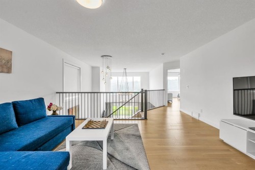 406 Rowley Way Nw, Calgary, AB - Indoor Photo Showing Living Room