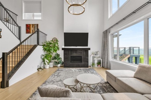 406 Rowley Way Nw, Calgary, AB - Indoor Photo Showing Living Room With Fireplace
