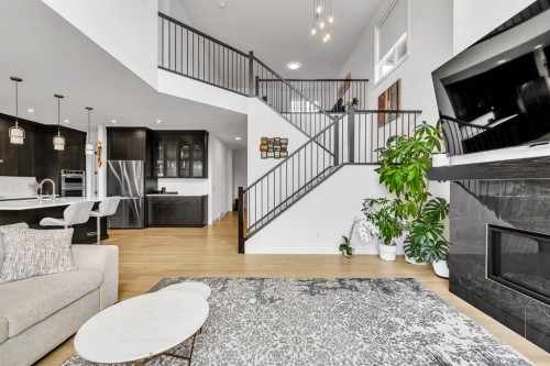 406 Rowley Way Nw, Calgary, AB - Indoor Photo Showing Living Room With Fireplace