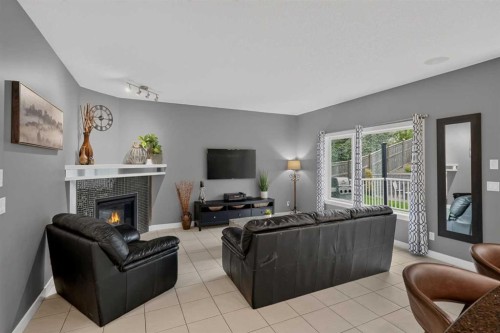 139 Nolanshire Point Nw, Calgary, AB - Indoor Photo Showing Living Room With Fireplace