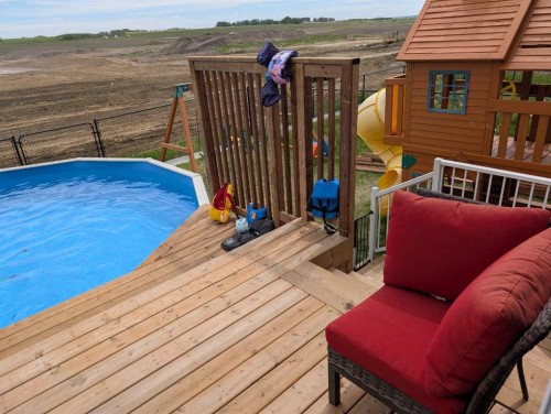 818 Edgefield Street, Strathmore, AB - Outdoor With Above Ground Pool With Deck Patio Veranda With Exterior