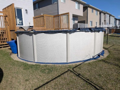 818 Edgefield Street, Strathmore, AB - Outdoor With Above Ground Pool With Exterior
