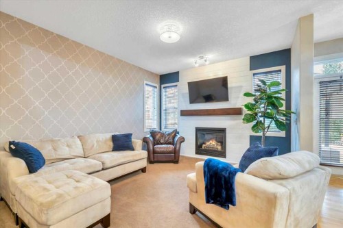 13 Cranberry Avenue Se, Calgary, AB - Indoor Photo Showing Living Room With Fireplace