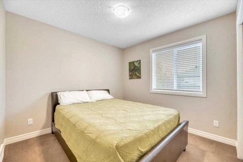 13 Cranberry Avenue Se, Calgary, AB - Indoor Photo Showing Bedroom