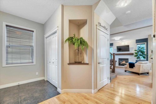 13 Cranberry Avenue Se, Calgary, AB - Indoor Photo Showing Other Room With Fireplace