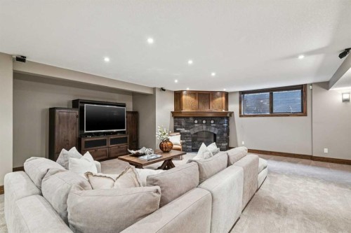 23 Bay View Drive Sw, Calgary, AB - Indoor Photo Showing Living Room With Fireplace