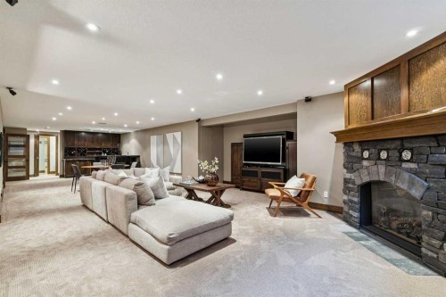 23 Bay View Drive Sw, Calgary, AB - Indoor Photo Showing Living Room With Fireplace