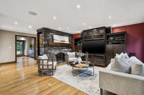 23 Bay View Drive Sw, Calgary, AB - Indoor Photo Showing Other Room With Fireplace