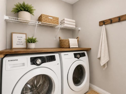 16 Fireside Way, Cochrane, AB - Indoor Photo Showing Laundry Room