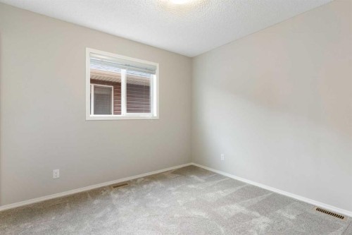 16 Fireside Way, Cochrane, AB - Indoor Photo Showing Other Room