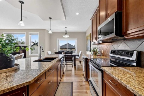 174 Cranridge Terrace Se, Calgary, AB - Indoor Photo Showing Kitchen With Stainless Steel Kitchen With Double Sink With Upgraded Kitchen