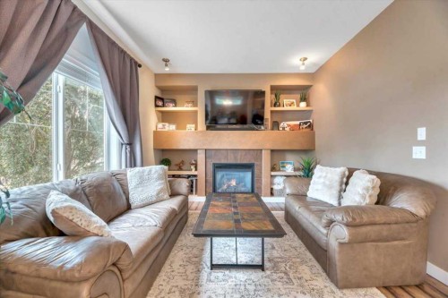 331 Ranch Ridge Meadow, Strathmore, AB - Indoor Photo Showing Living Room With Fireplace