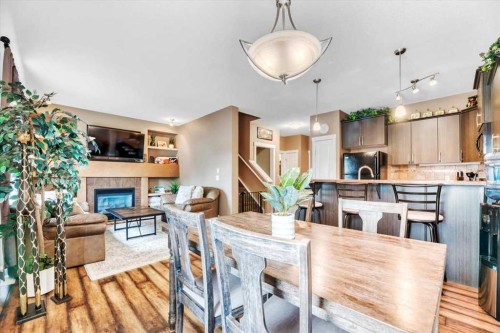 331 Ranch Ridge Meadow, Strathmore, AB - Indoor Photo Showing Dining Room With Fireplace