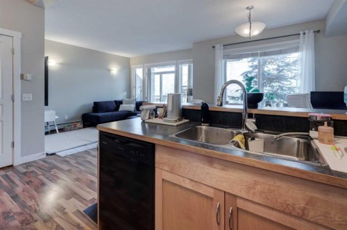 1203-211 Aspen Stone Boulevard Sw, Calgary, AB - Indoor Photo Showing Kitchen With Double Sink