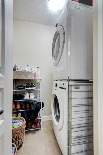 1203-211 Aspen Stone Boulevard Sw, Calgary, AB - Indoor Photo Showing Laundry Room