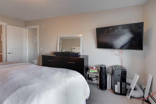 1203-211 Aspen Stone Boulevard Sw, Calgary, AB - Indoor Photo Showing Bedroom