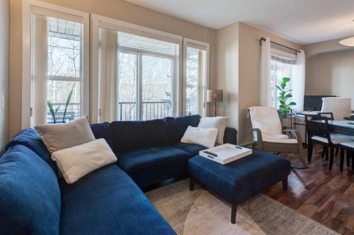 1203-211 Aspen Stone Boulevard Sw, Calgary, AB - Indoor Photo Showing Living Room