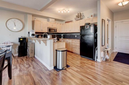 1203-211 Aspen Stone Boulevard Sw, Calgary, AB - Indoor Photo Showing Kitchen