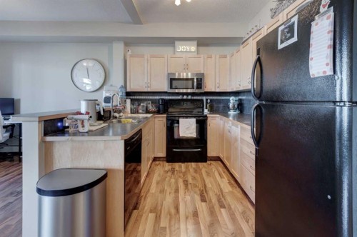 1203-211 Aspen Stone Boulevard Sw, Calgary, AB - Indoor Photo Showing Kitchen