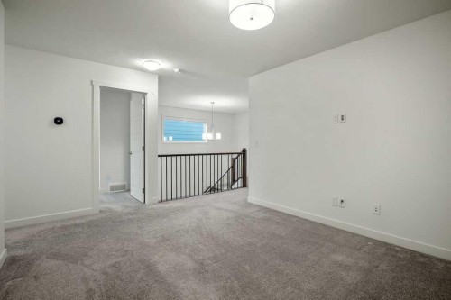 882 Bluerock Way Sw, Calgary, AB - Indoor Photo Showing Other Room