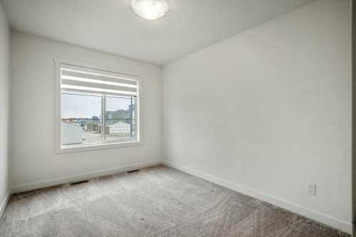 882 Bluerock Way Sw, Calgary, AB - Indoor Photo Showing Other Room