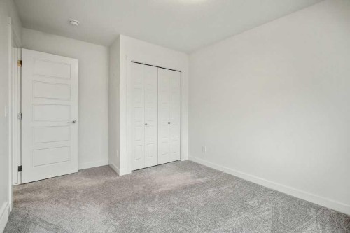 882 Bluerock Way Sw, Calgary, AB - Indoor Photo Showing Other Room