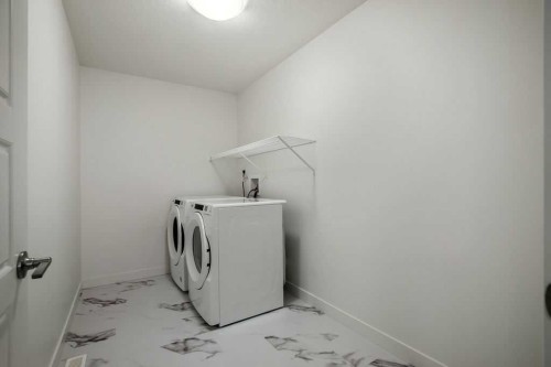 882 Bluerock Way Sw, Calgary, AB - Indoor Photo Showing Laundry Room