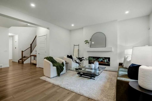882 Bluerock Way Sw, Calgary, AB - Indoor With Fireplace