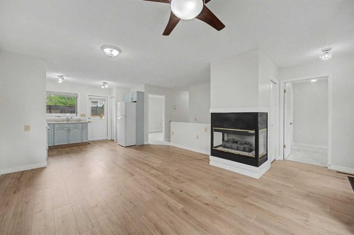 2640 Dovely Court Se, Calgary, AB - Indoor Photo Showing Living Room With Fireplace