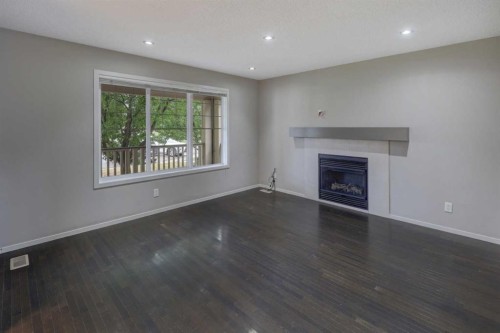 36 Copperstone Court Se, Calgary, AB - Indoor Photo Showing Living Room With Fireplace