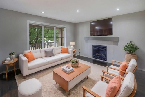 36 Copperstone Court Se, Calgary, AB - Indoor Photo Showing Living Room With Fireplace