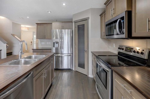 36 Copperstone Court Se, Calgary, AB - Indoor Photo Showing Kitchen With Double Sink