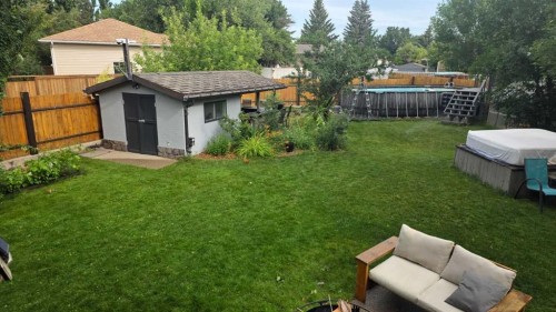 419 Kenex Place, Nobleford, AB - Outdoor With Backyard