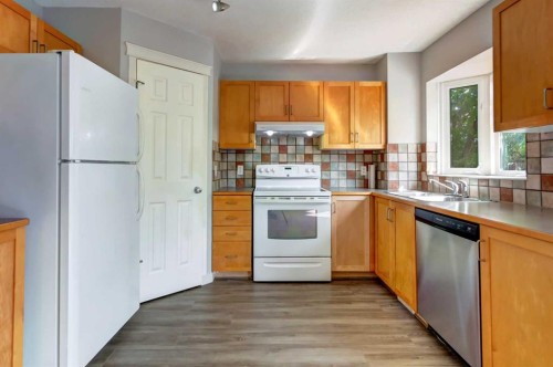 33 Everstone Avenue Sw, Calgary, AB - Indoor Photo Showing Kitchen With Double Sink