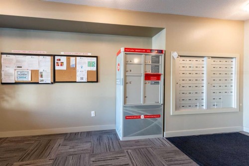 8112-403 Mackenzie Way Se, Airdrie, AB - Indoor Photo Showing Other Room