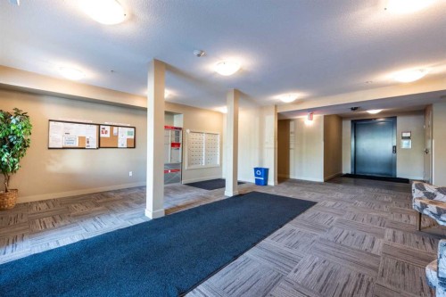8112-403 Mackenzie Way Se, Airdrie, AB - Indoor Photo Showing Other Room