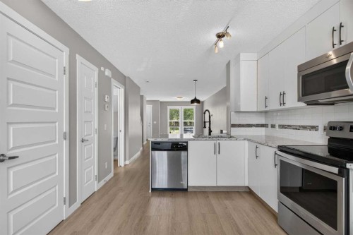75 Auburn Bay Street Se, Calgary, AB - Indoor Photo Showing Kitchen With Stainless Steel Kitchen With Upgraded Kitchen