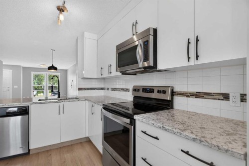 75 Auburn Bay Street Se, Calgary, AB - Indoor Photo Showing Kitchen With Stainless Steel Kitchen With Upgraded Kitchen