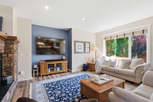 31 Chapala Close Se, Calgary, AB - Indoor Photo Showing Living Room With Fireplace